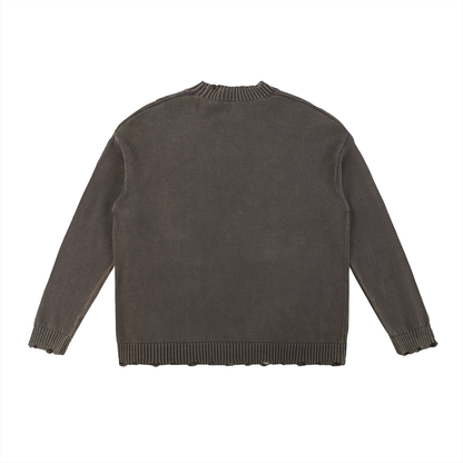 Gray knitted sweater with distressed edges.
