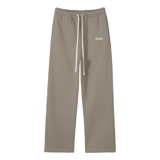 Tan sweatpants with a white drawstring and the word "YAYOHOUSE" on one leg.
