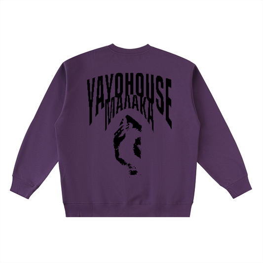 A purple sweatshirt with black graphics on the back.