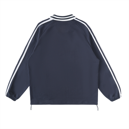 Back of a dark blue track jacket with white stripes.