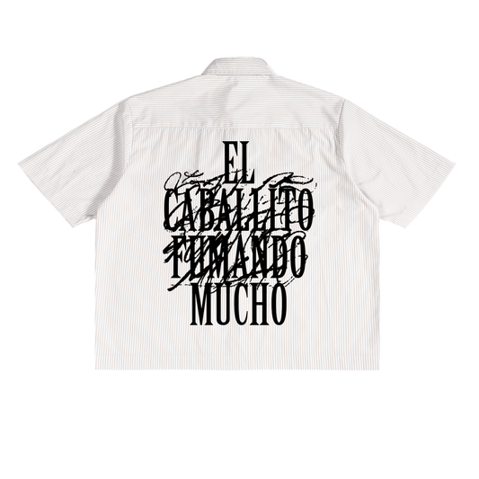 White striped shirt with black text on the back.