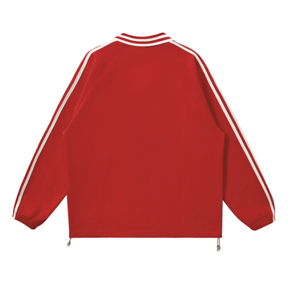 Red and white long-sleeve track jacket.

