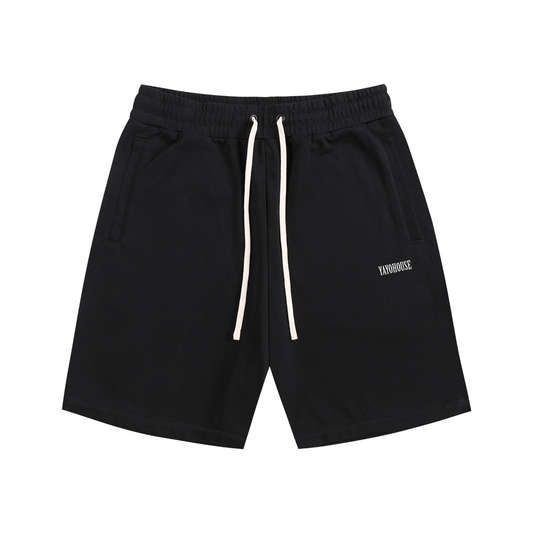 Black athletic shorts with cream-colored drawstring.