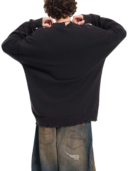 Person wearing a black sweater and jeans from behind on a white background