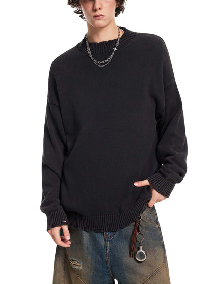 Person wearing a black sweater with a white background