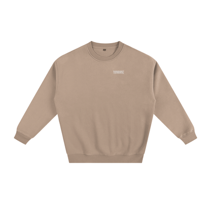 Tan crew neck sweatshirt with white lettering.