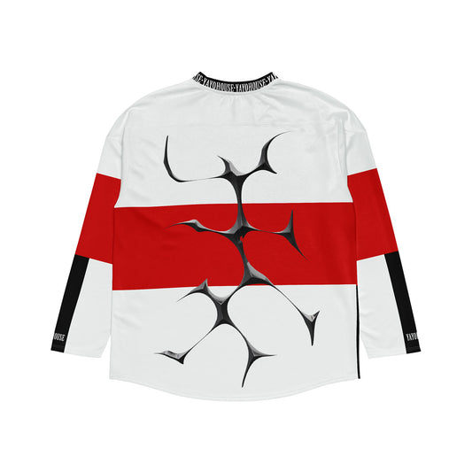 White and red long-sleeved jersey with black accents and abstract graphic.