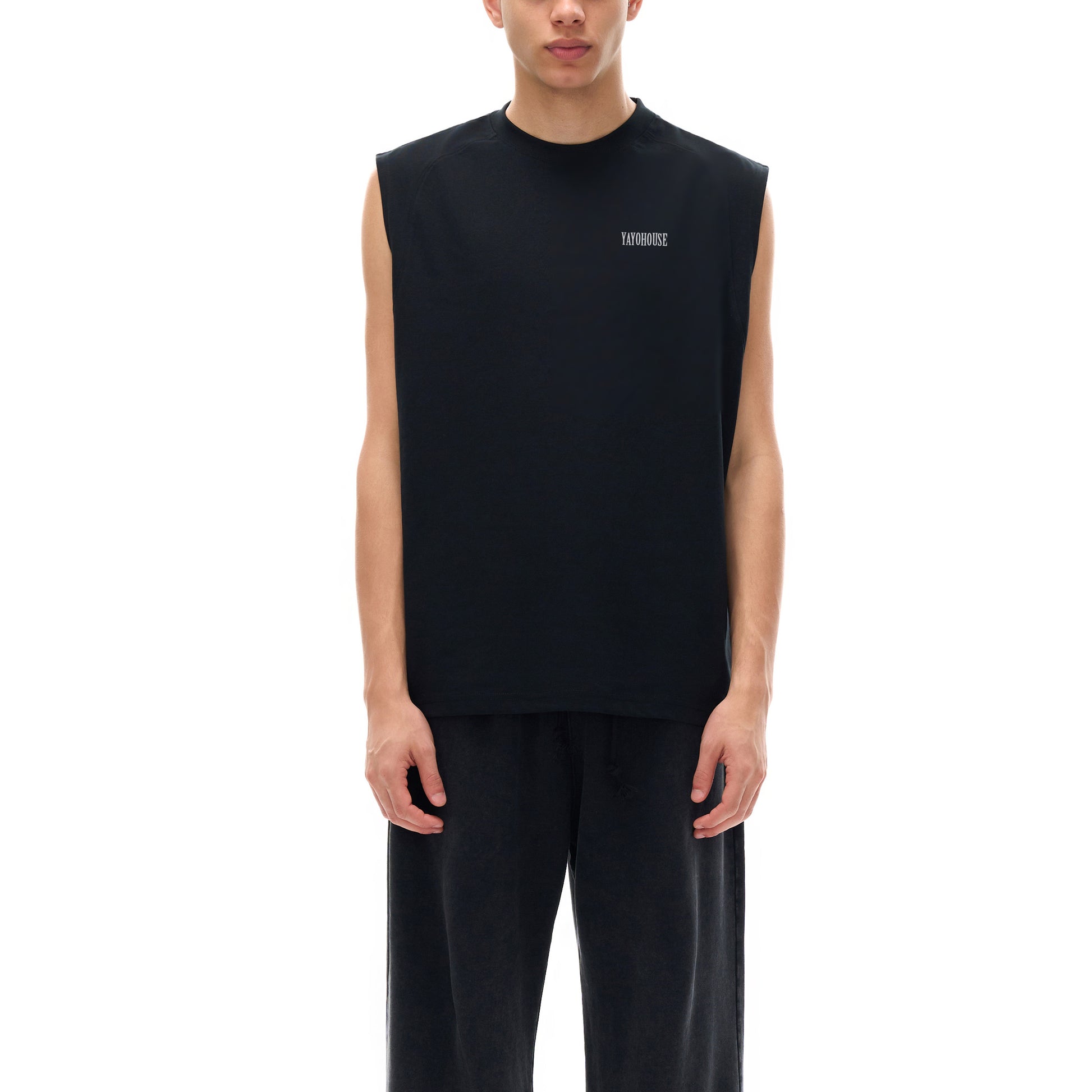 Man in black sleeveless shirt and pants.