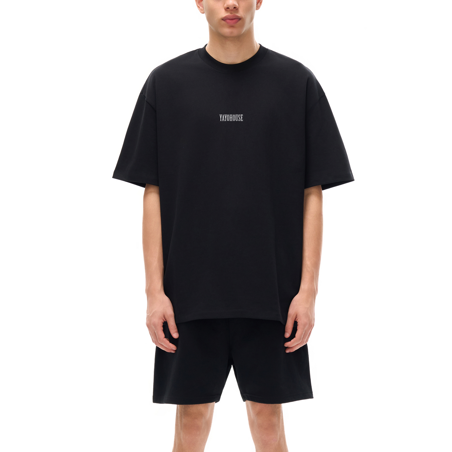 Man in matching black T-shirt and shorts.