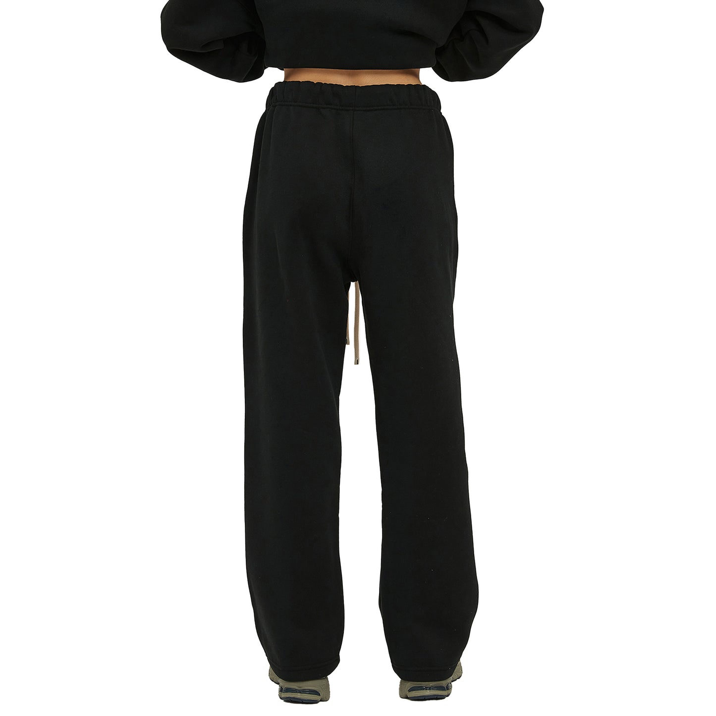 Back view of black sweatpants with a drawstring at the waist.
